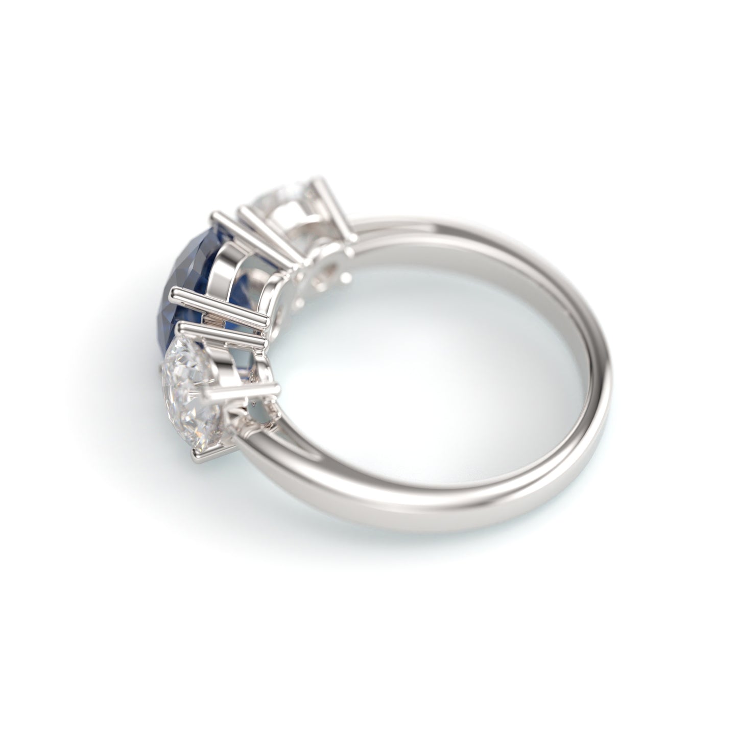 Classic Round Three Stone Sapphire Engagement Ring.