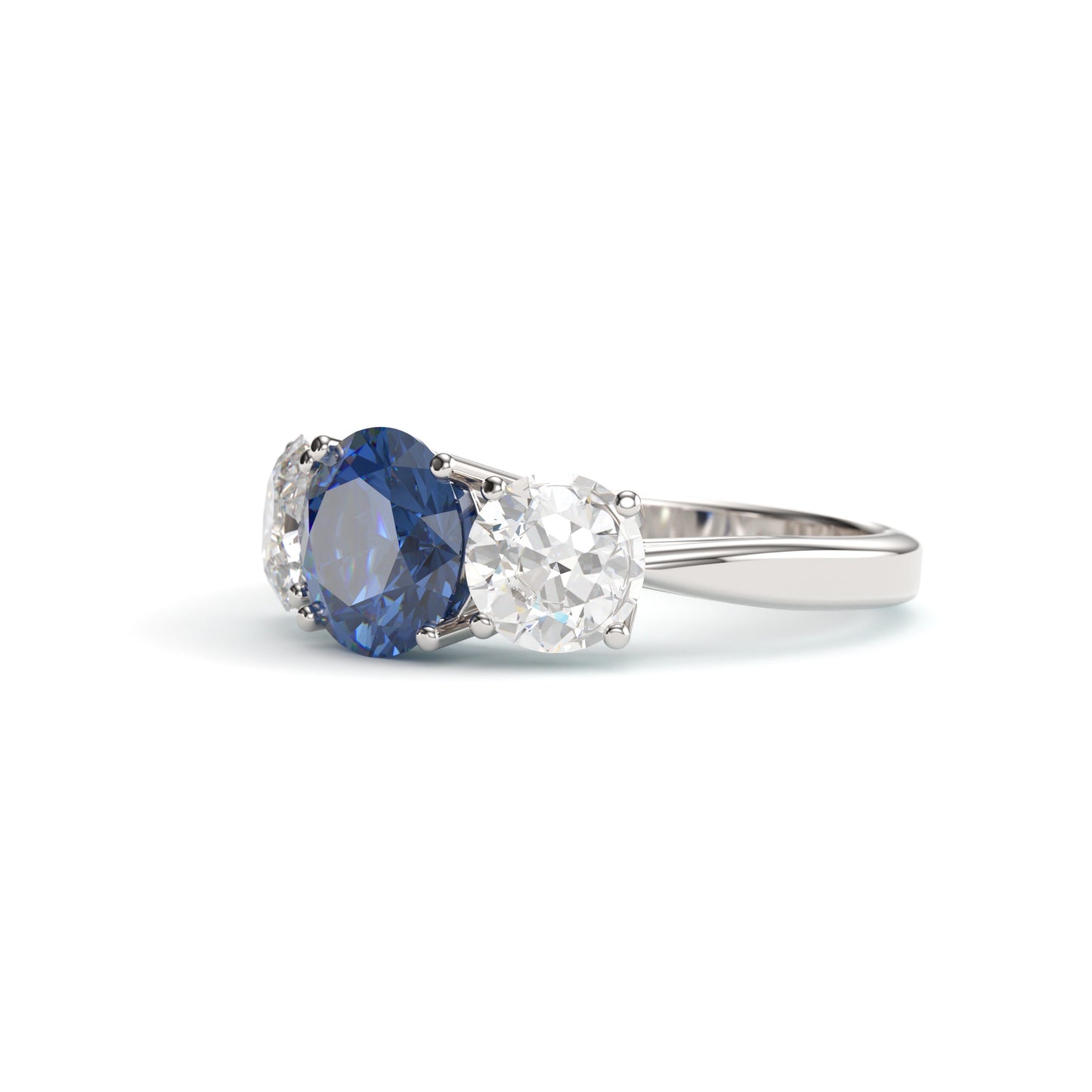 Classic Round Three Stone Sapphire Engagement Ring.